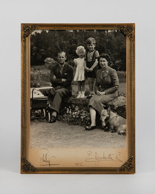 A signed photograph of Queen Elizabeth II, Prince Philip, Prince Charles and Princess Anne at Balmoral Castle, Scotland, 1955, taken by Marcus Adams