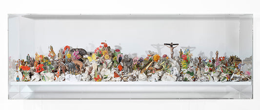 Cut and crumpled book page construction in an acrylic case by Jake Milroy, titled A Trashcan World. 