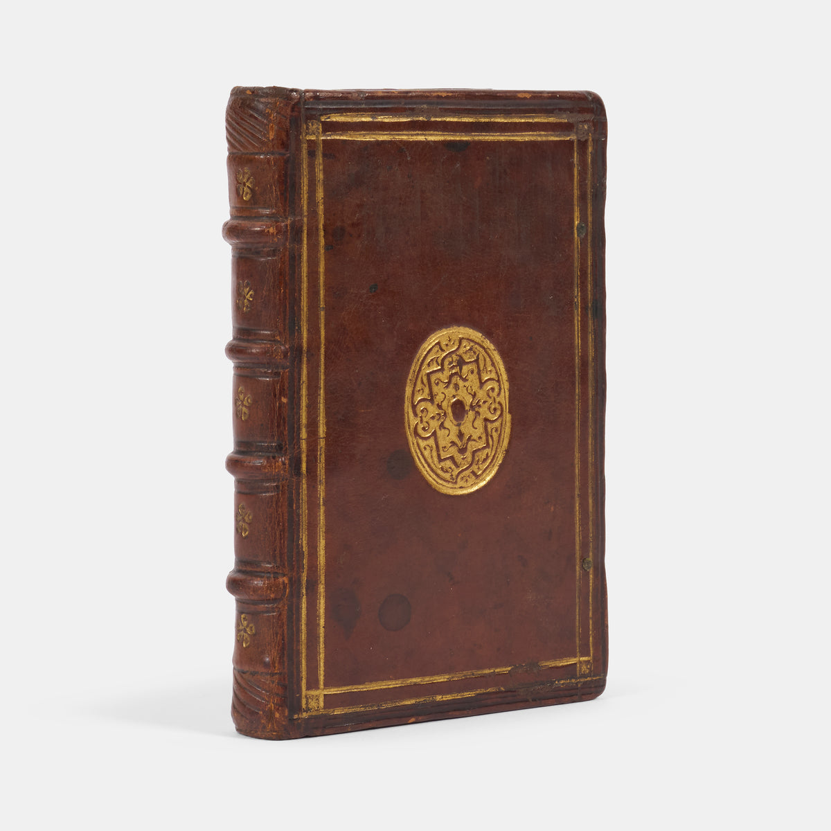An early edition in English of Sir Anthony Fitzherbert's practical manual The Newe Boke of Justices of Peace, in a contemporary English gilt tooled binding