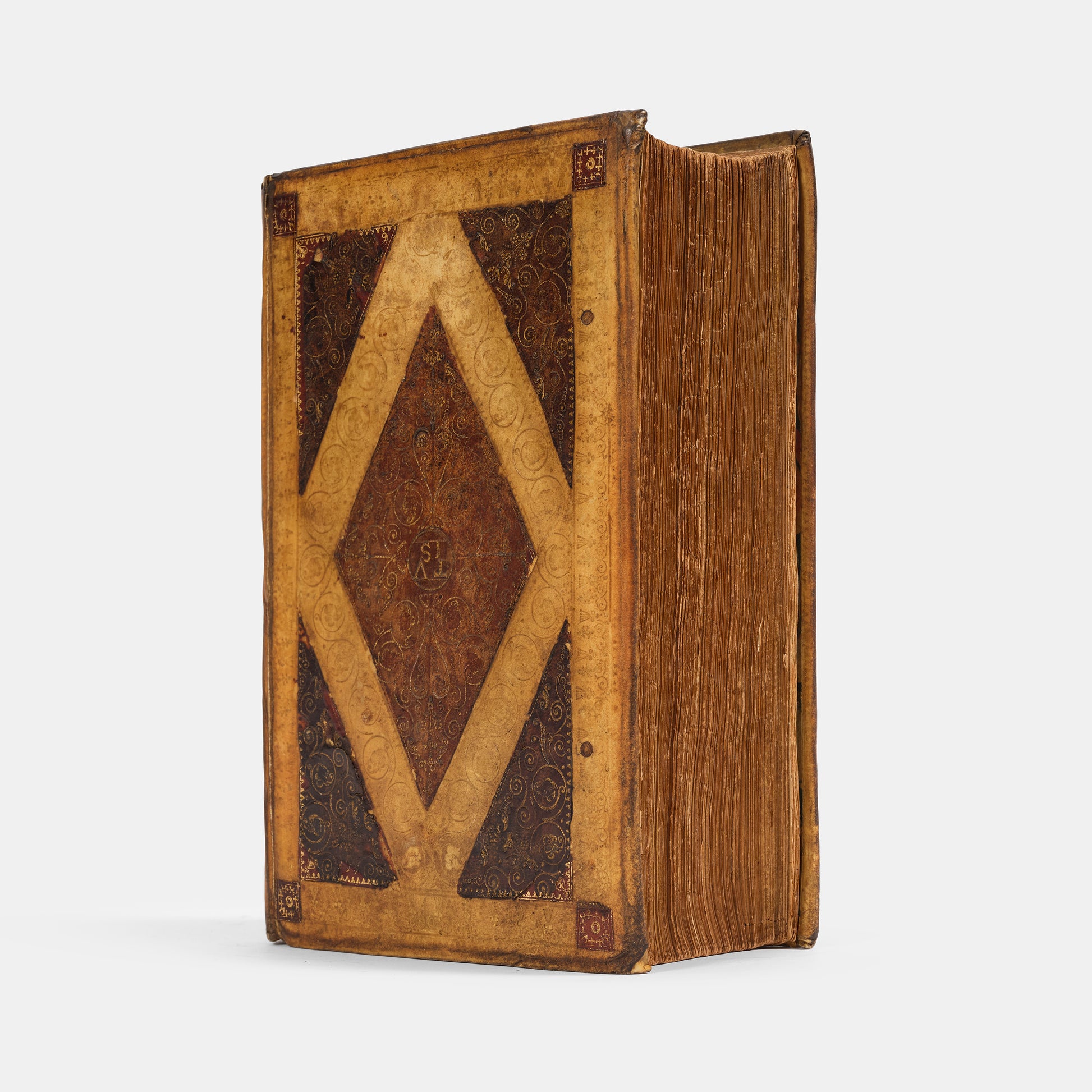 A remarkable copy of the second quarto edition of the Geneva Bible, complete with hand-coloured woodcut illustrations and 5 maps, and bound in seventeenth-century vellum gilt onlaid in red morocco