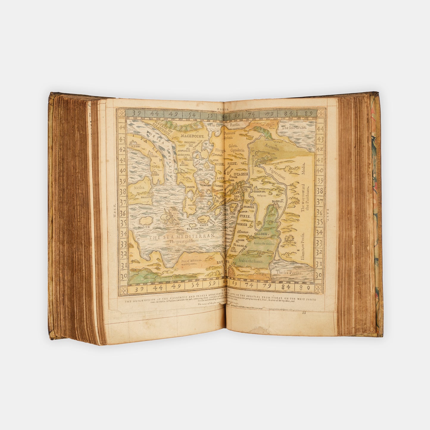 A remarkable copy of the second quarto edition of the Geneva Bible, complete with hand-coloured woodcut illustrations and 5 maps, and bound in seventeenth-century vellum gilt onlaid in red morocco