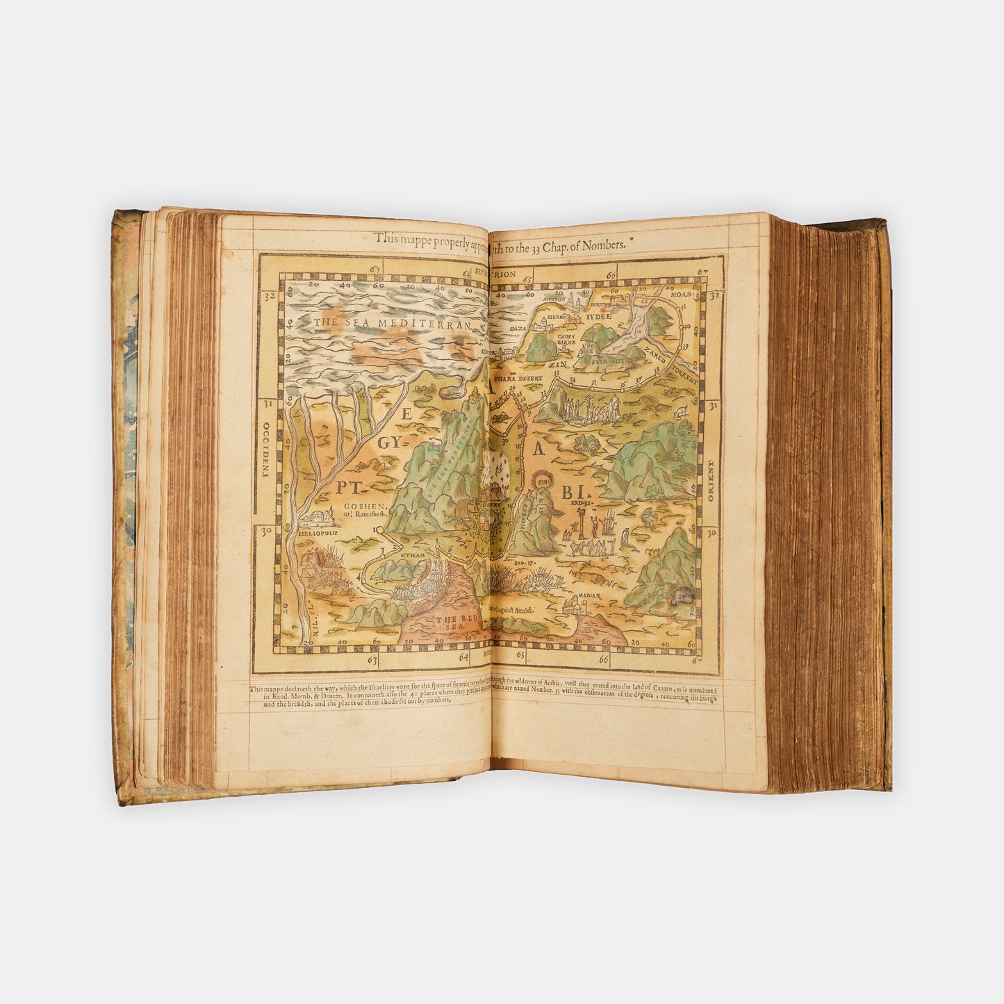 A remarkable copy of the second quarto edition of the Geneva Bible, complete with hand-coloured woodcut illustrations and 5 maps, and bound in seventeenth-century vellum gilt onlaid in red morocco