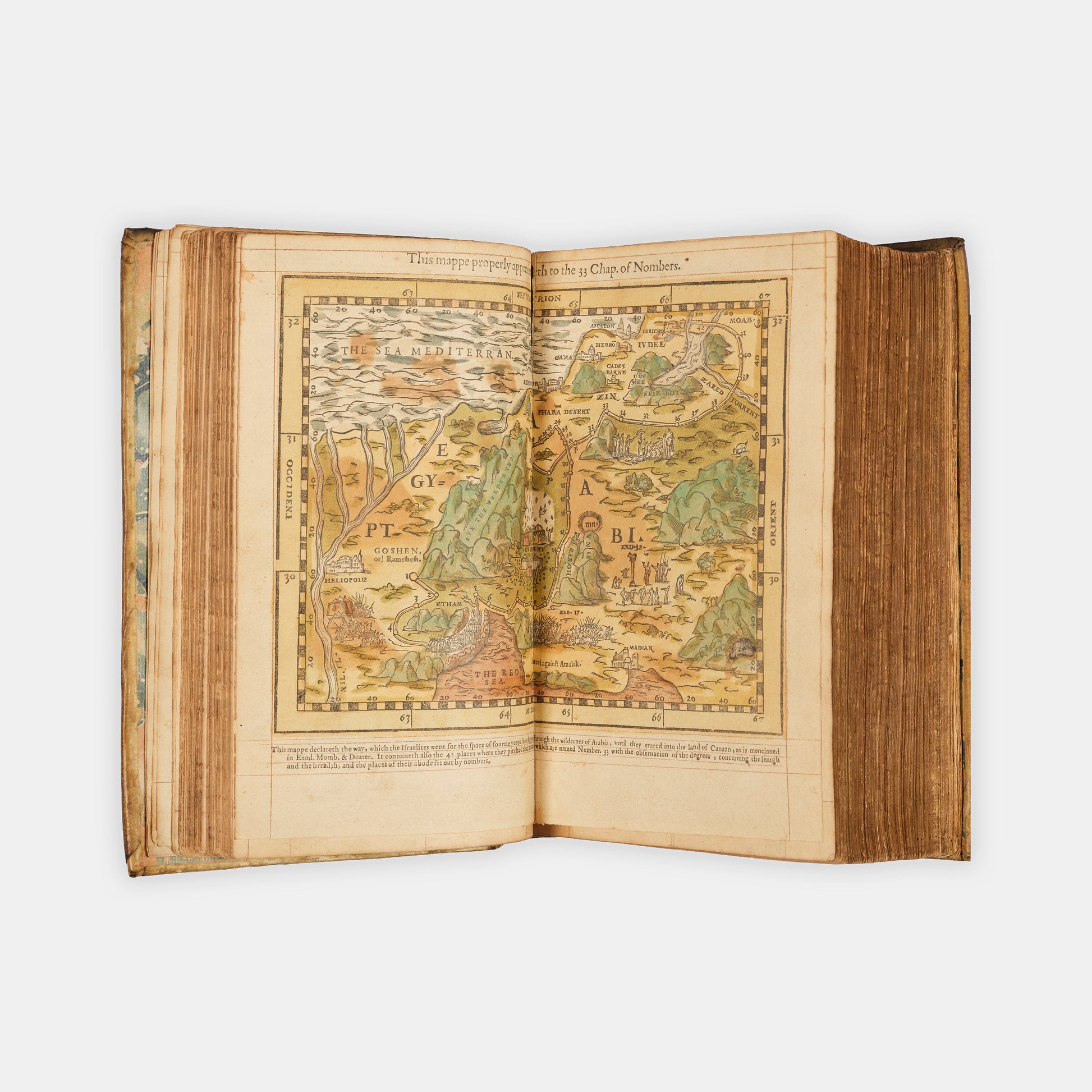 A remarkable copy of the second quarto edition of the Geneva Bible, complete with hand-coloured woodcut illustrations and 5 maps, and bound in seventeenth-century vellum gilt onlaid in red morocco