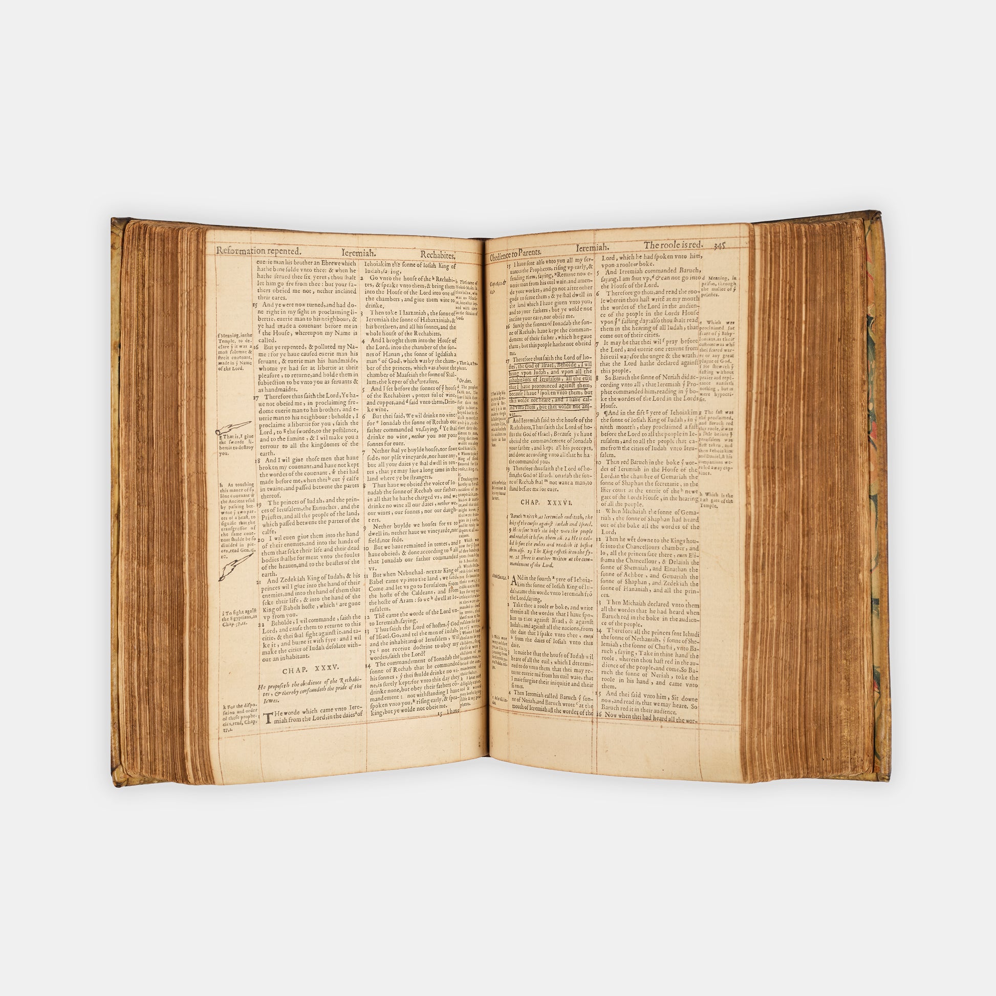 A remarkable copy of the second quarto edition of the Geneva Bible, complete with hand-coloured woodcut illustrations and 5 maps, and bound in seventeenth-century vellum gilt onlaid in red morocco