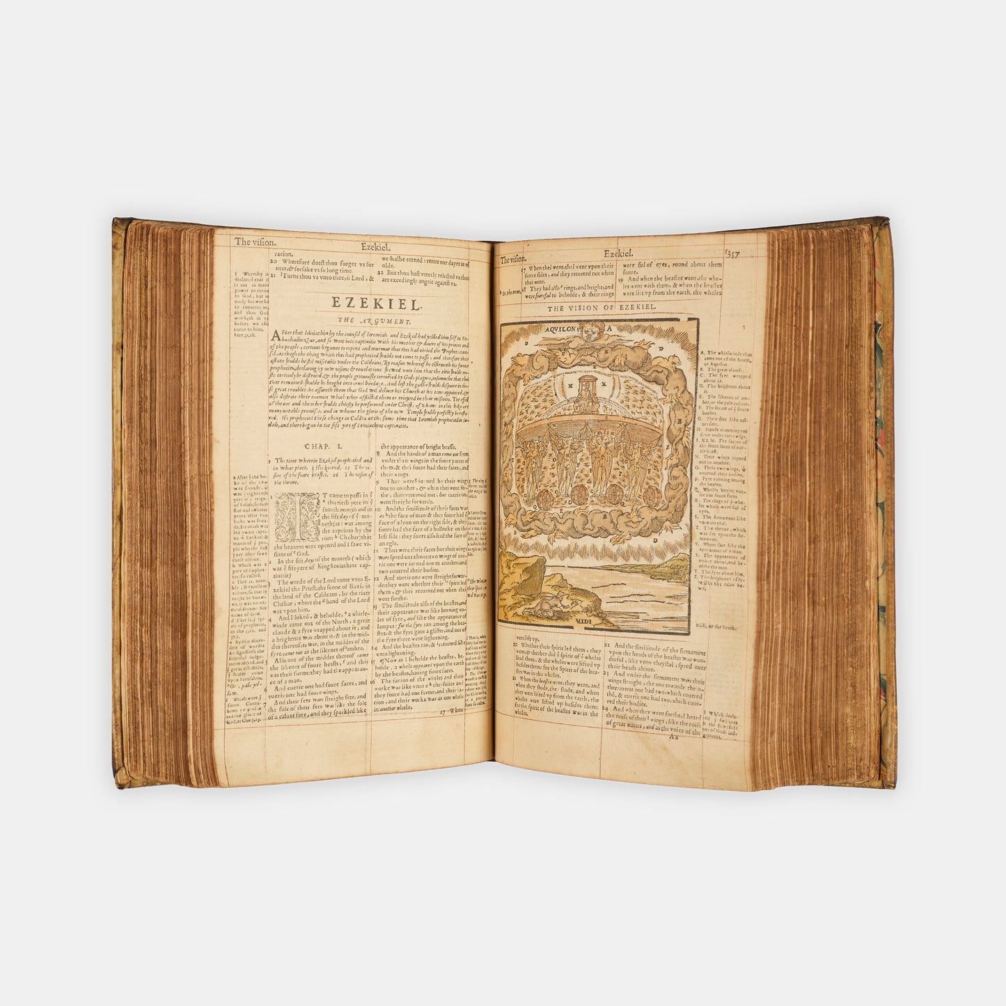 A remarkable copy of the second quarto edition of the Geneva Bible, complete with hand-coloured woodcut illustrations and 5 maps, and bound in seventeenth-century vellum gilt onlaid in red morocco