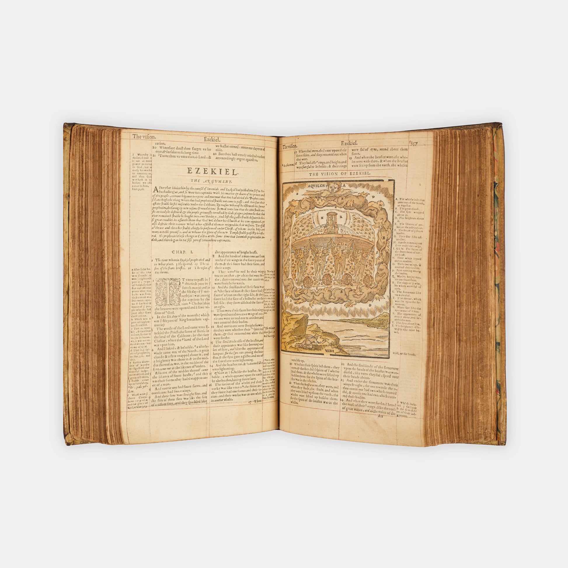 A remarkable copy of the second quarto edition of the Geneva Bible, complete with hand-coloured woodcut illustrations and 5 maps, and bound in seventeenth-century vellum gilt onlaid in red morocco