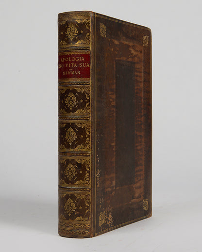 The first edition of John Henry Newman's great spiritual autobiography, the Apologia pro Vita Sua, with the original wrappers bound-in to the rear