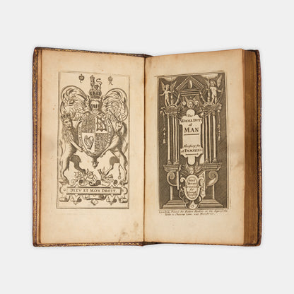 A beautiful example of Richard Allestree's The Whole Duty of Man, well-preserved in this English Restoration red goatskin binding