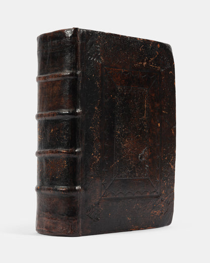 A superb, rare complete example of the Geneva Bible, bound with the Book of Common Prayer, Concordances and Pslam, in the original blind-panelled calf binding