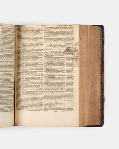 A superb, rare complete example of the Geneva Bible, bound with the Book of Common Prayer, Concordances and Pslam, in the original blind-panelled calf binding