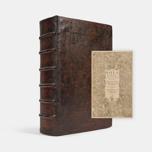 The first distinct folio edition of the King James Bible, complete in the contemporary blind-panelled calf binding with Speed's Genealogies, including his double-page map of Canaan