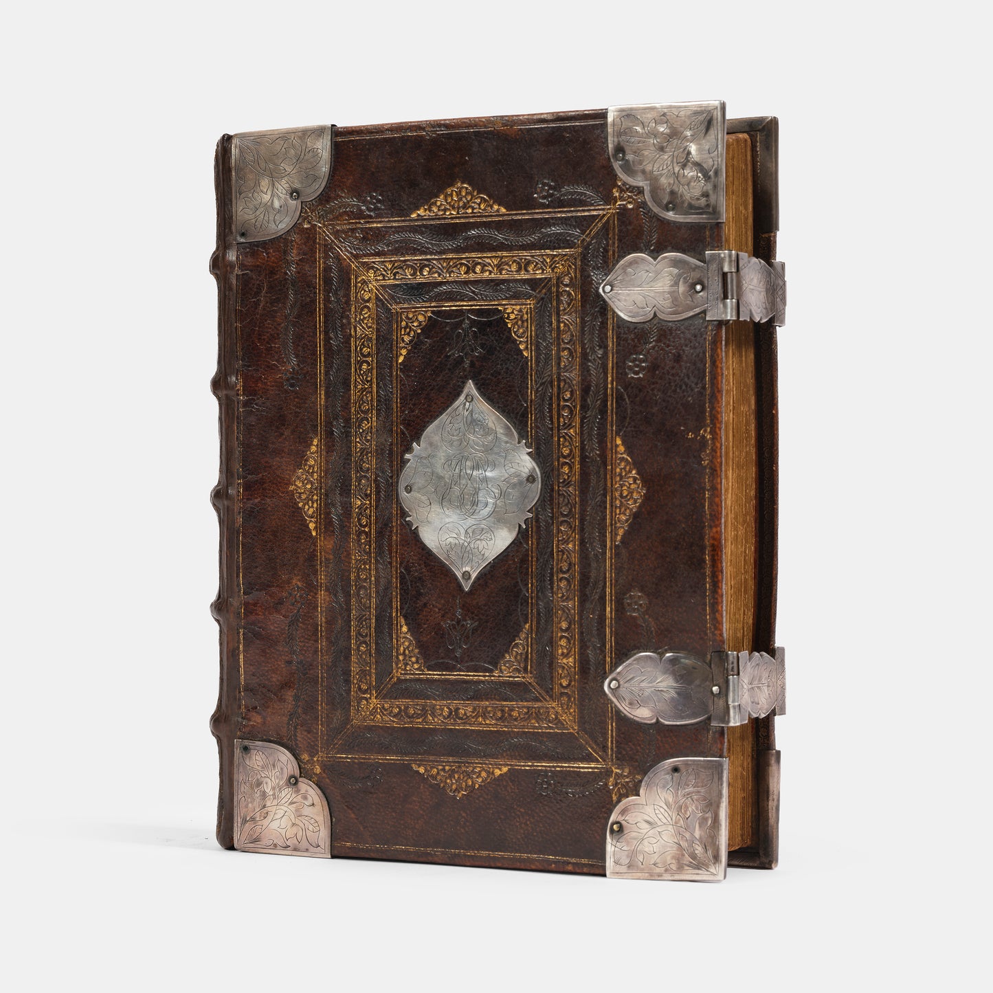 An impressive mid-seventeenth century King James Bible, splendidly preserved in an English Restoration binding of gilt panelled blackmorocco with silver furniture including the original working clasps