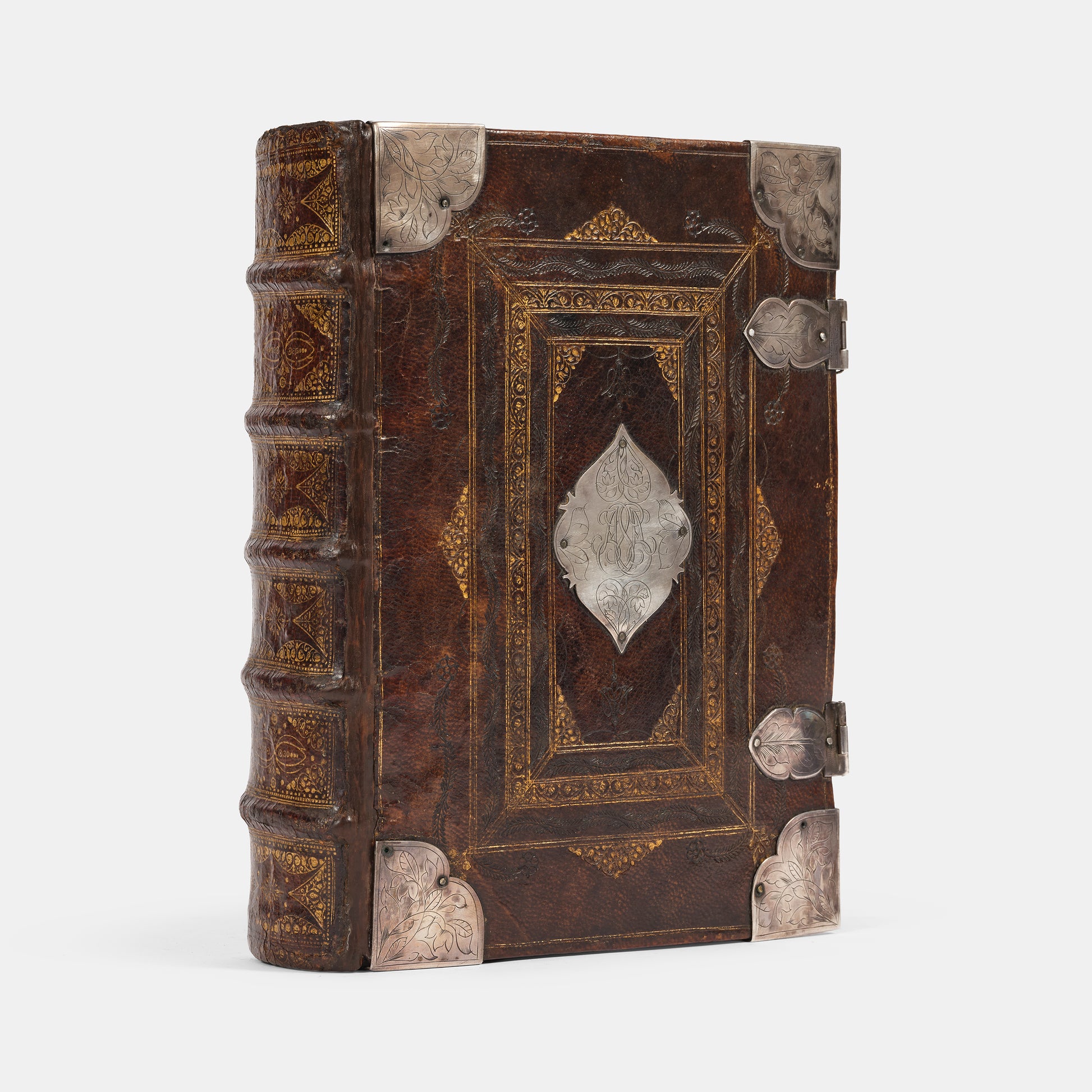 An impressive mid-seventeenth century King James Bible, splendidly preserved in an English Restoration binding of gilt panelled blackmorocco with silver furniture including the original working clasps