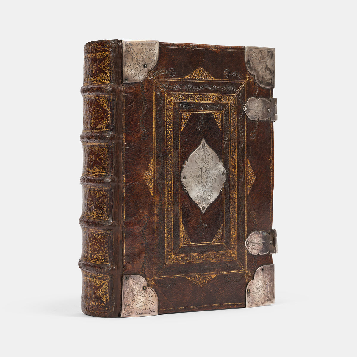 An impressive mid-seventeenth century King James Bible, splendidly preserved in an English Restoration binding of gilt panelled blackmorocco with silver furniture including the original working clasps