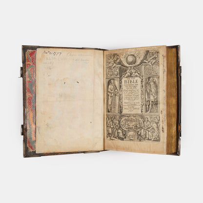 An impressive mid-seventeenth century King James Bible, splendidly preserved in an English Restoration binding of gilt panelled blackmorocco with silver furniture including the original working clasps