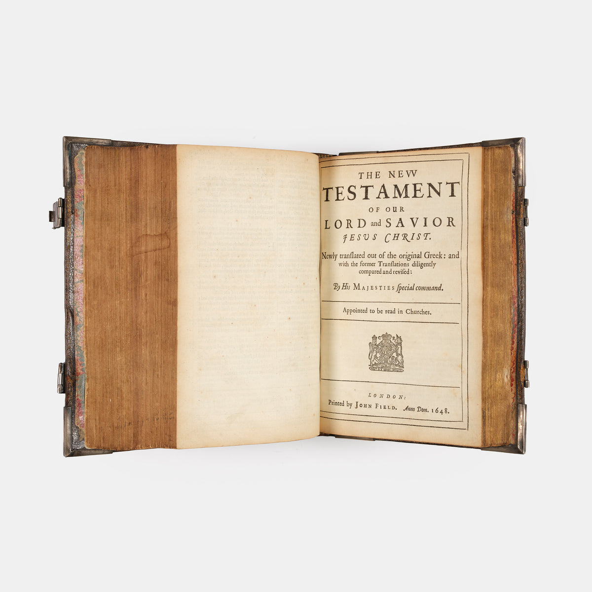 An impressive mid-seventeenth century King James Bible, splendidly preserved in an English Restoration binding of gilt panelled blackmorocco with silver furniture including the original working clasps