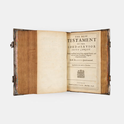 An impressive mid-seventeenth century King James Bible, splendidly preserved in an English Restoration binding of gilt panelled blackmorocco with silver furniture including the original working clasps