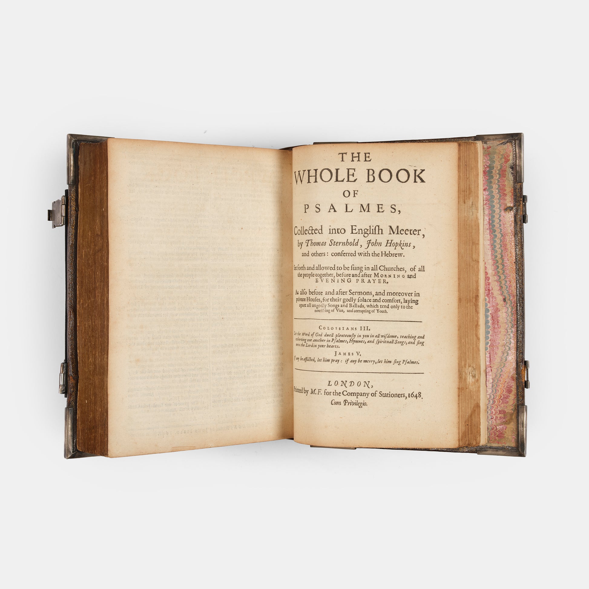 An impressive mid-seventeenth century King James Bible, splendidly preserved in an English Restoration binding of gilt panelled blackmorocco with silver furniture including the original working clasps