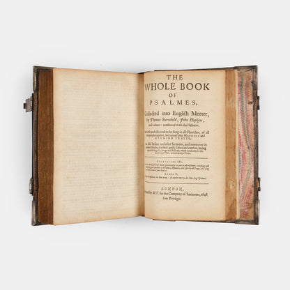 An impressive mid-seventeenth century King James Bible, splendidly preserved in an English Restoration binding of gilt panelled blackmorocco with silver furniture including the original working clasps