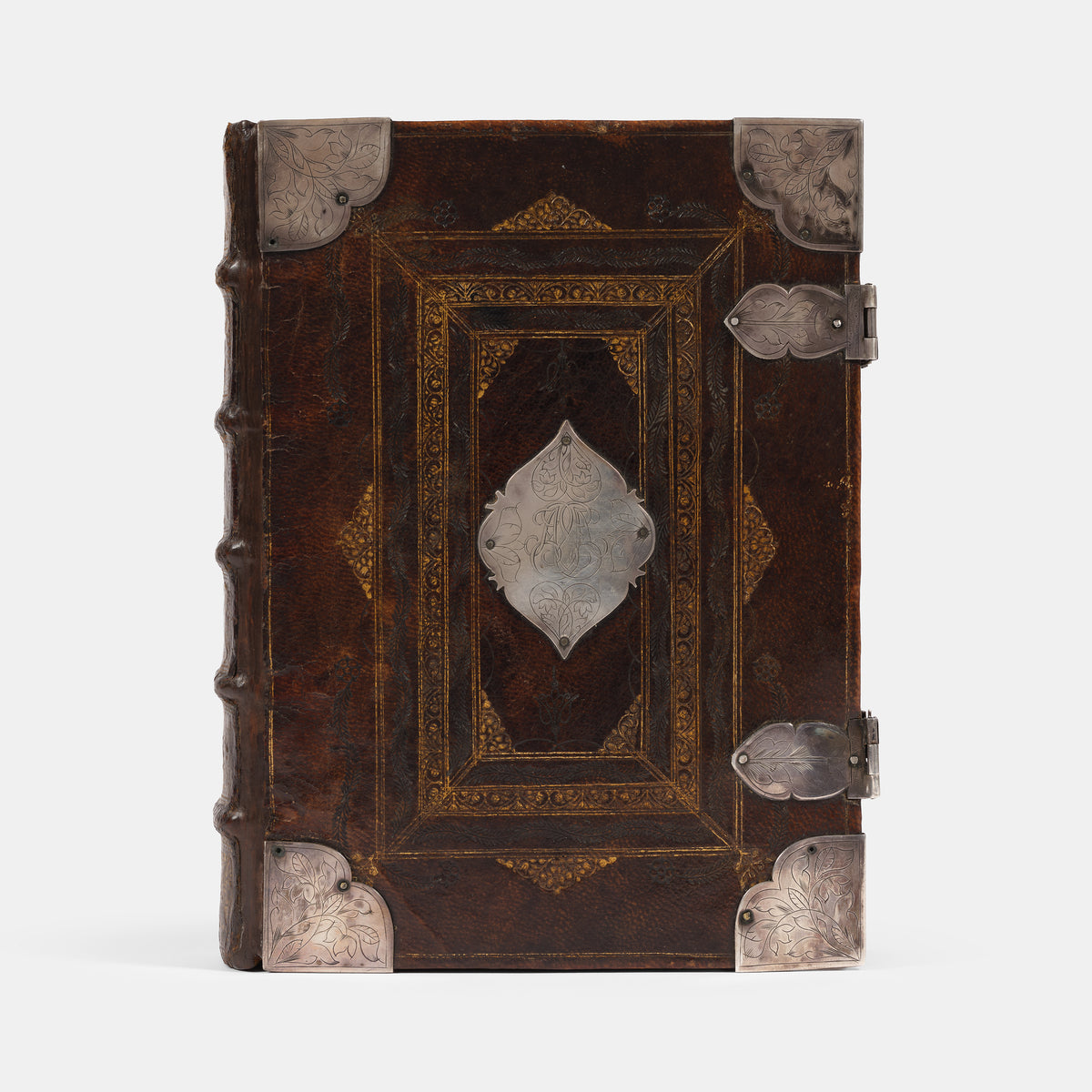 An impressive mid-seventeenth century King James Bible, splendidly preserved in an English Restoration binding of gilt panelled blackmorocco with silver furniture including the original working clasps
