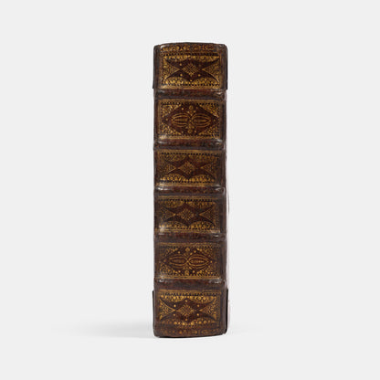 An impressive mid-seventeenth century King James Bible, splendidly preserved in an English Restoration binding of gilt panelled blackmorocco with silver furniture including the original working clasps