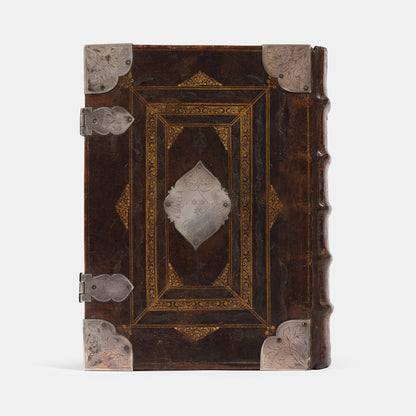 An impressive mid-seventeenth century King James Bible, splendidly preserved in an English Restoration binding of gilt panelled blackmorocco with silver furniture including the original working clasps
