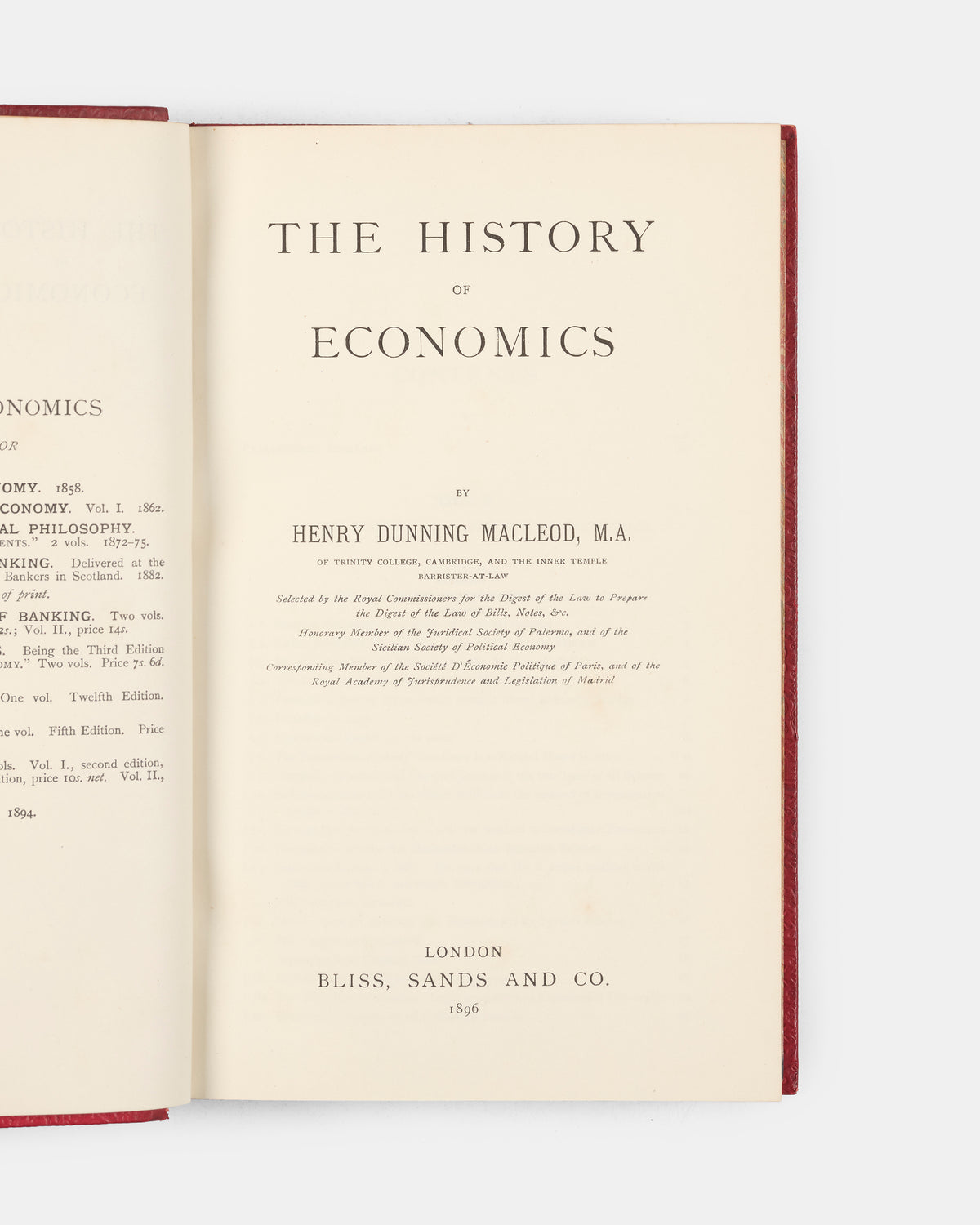 A scarce first edition of Henry Dunning Macleod's History of Economics bound in full red calf for the Bradford Modern School. 