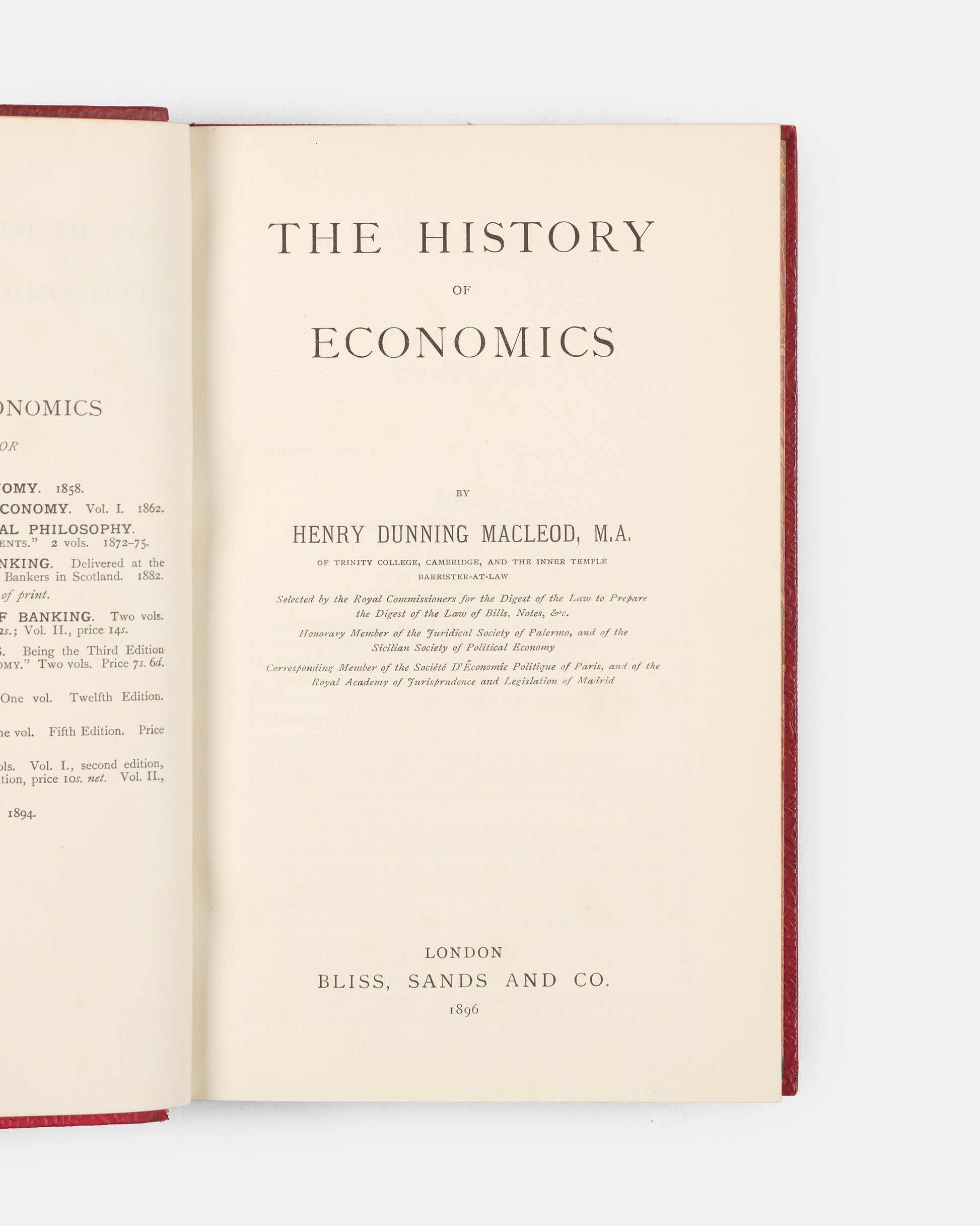 A scarce first edition of Henry Dunning Macleod's History of Economics bound in full red calf for the Bradford Modern School. 