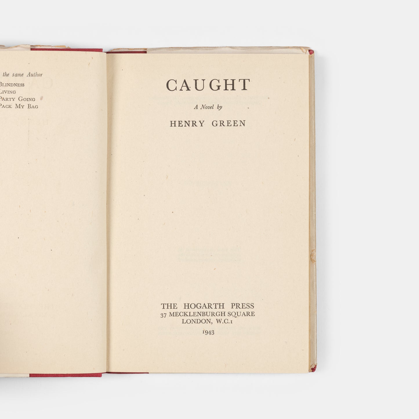 First edition, second impression of <em>Caught</em> by Henry Green, a novel inspired by his experiences as a member of London's Auxiliary Fire Service during the Blitz
