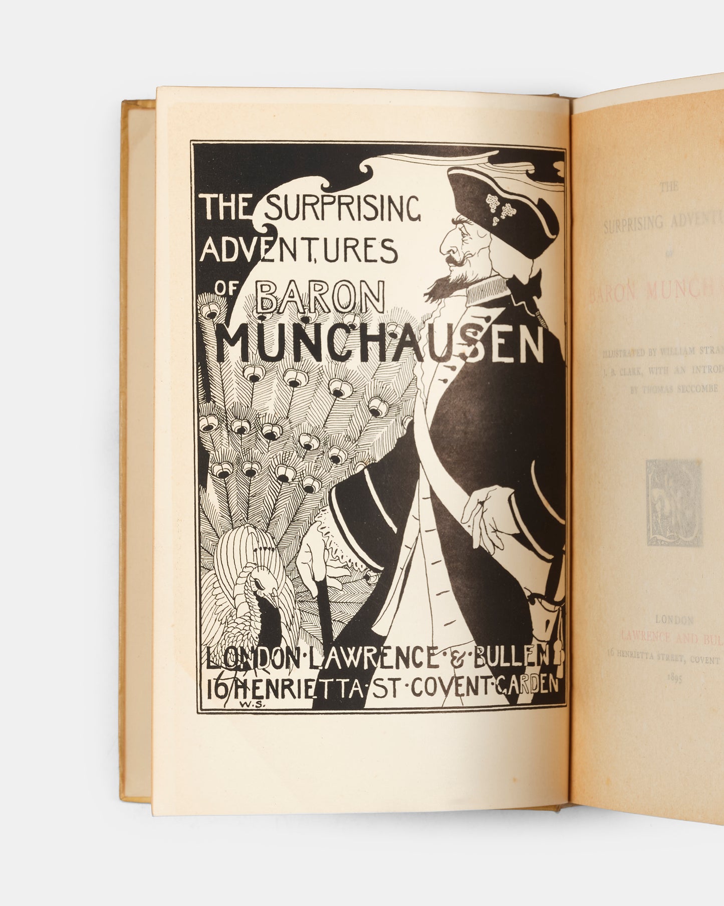 A handsome copy of The Surprising Adventures of Baron Munchausen illustrated by William Strang, and J.B. Clark.