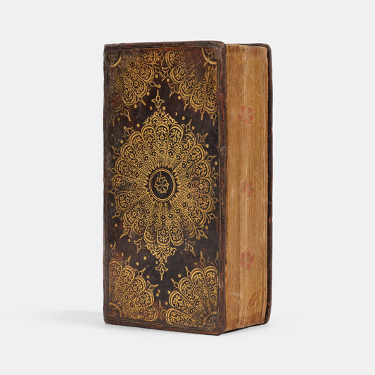 A charming, mid-seventeenth century 'fan' binding of dark brown calfskin tooled in gilt, enclosing a scarce pocket edition of the Kind James Bible