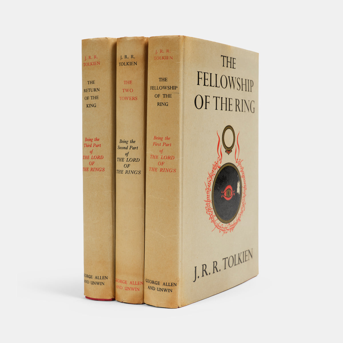 First editions, thirteenth and tenth impressions, of J.R.R. Tolkien's <em>The Lord of the Rings</em> trilogy