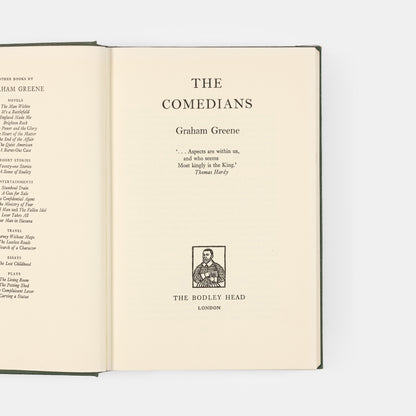 First edition of The Comedians by Graham Greene, inscribed by the author to Sherman and Jeanne Stonor.