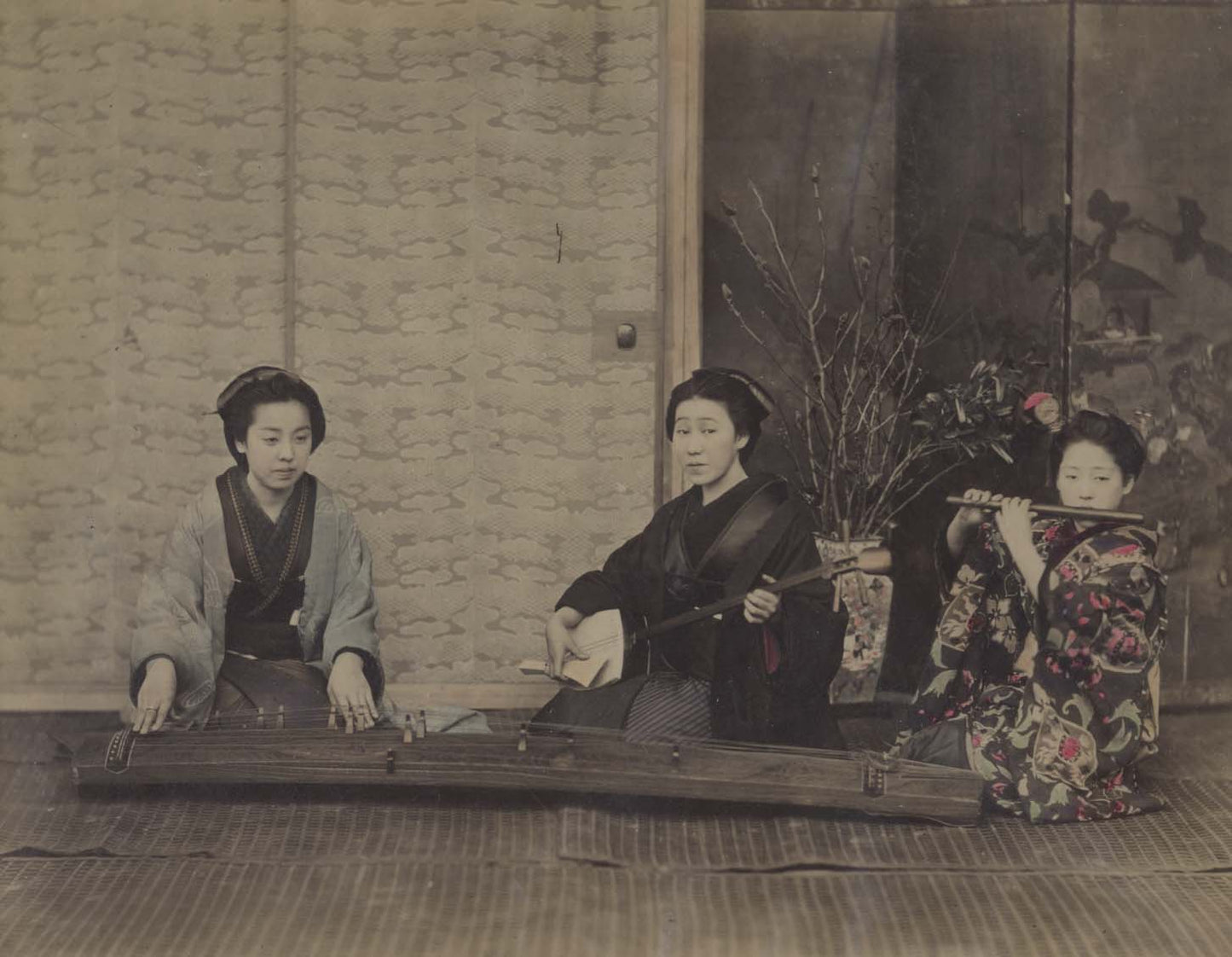 A group of three Geisha playing the Koto, Shamisen and Fuye