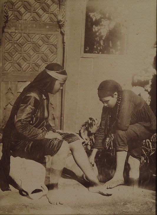 [Women washing feet].