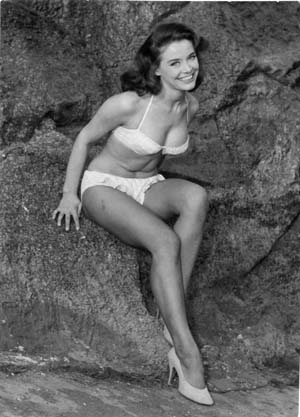 [Lady sitting on a rock]