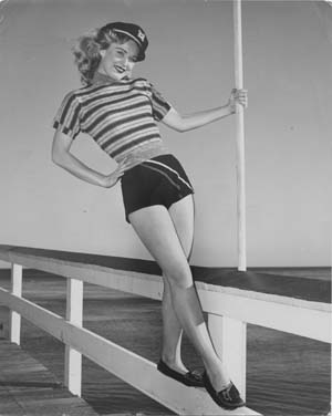 [Lady posing on jetty].