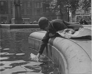 [Dipping into the Trafalgar Square Fountain, London].