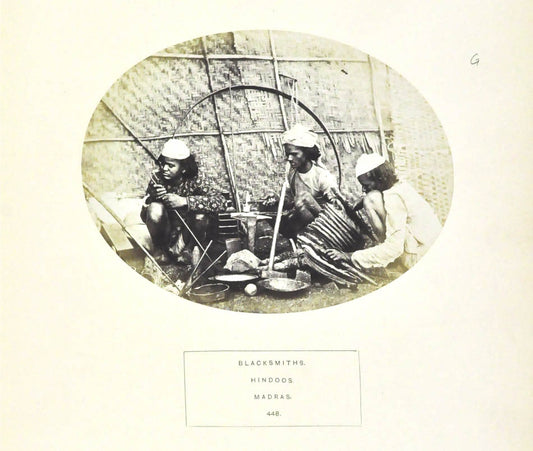 An albumen print.  Blacksmiths. Hindoos. Madras.  From The People of India - a series of photographic illustrations... edited by J. Forbes Watson.
