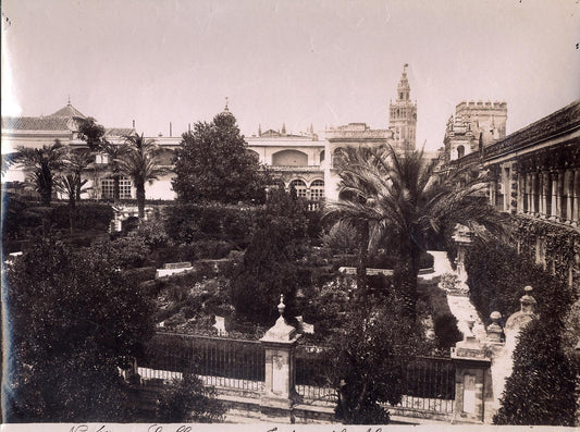 [Gardens of Alcazar in the Palace of Seville, with palace in background].