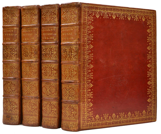 A very handsome set of this 4 volume large paper copy of the Works of Joseph Addison, printed by Tonson in London, 1721, bound in contemporary red morocco 