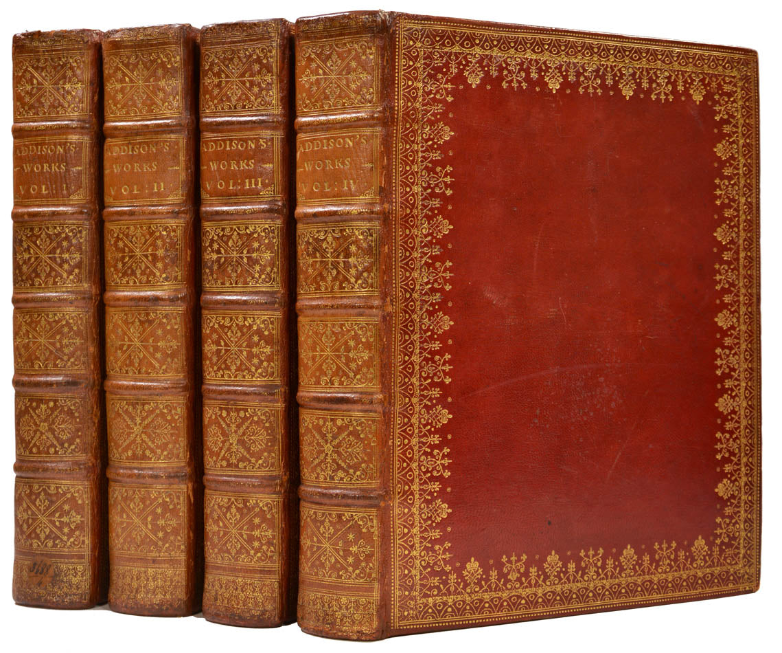 A very handsome set of this 4 volume large paper copy of the Works of Joseph Addison, printed by Tonson in London, 1721, bound in contemporary red morocco 