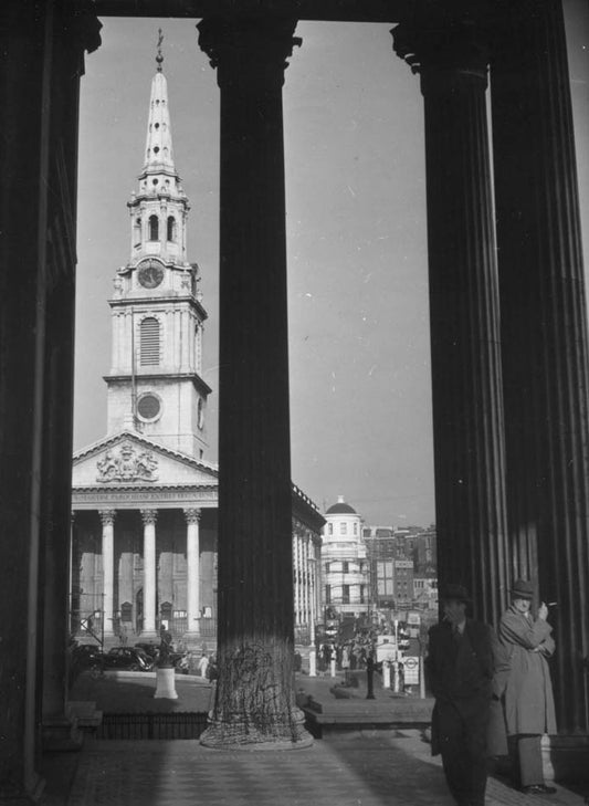 St. Martin's-in-the-Fields seen through columns of National Gallery, London.