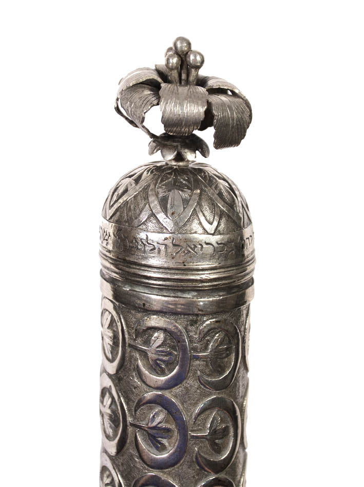 Esther scroll housed in an elaborately decorated silver case. Manuscript on vellum, text arranged in 19 lines, in Hebrew Sephardic Script. 