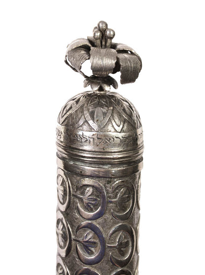 Esther scroll housed in an elaborately decorated silver case. Manuscript on vellum, text arranged in 19 lines, in Hebrew Sephardic Script. 