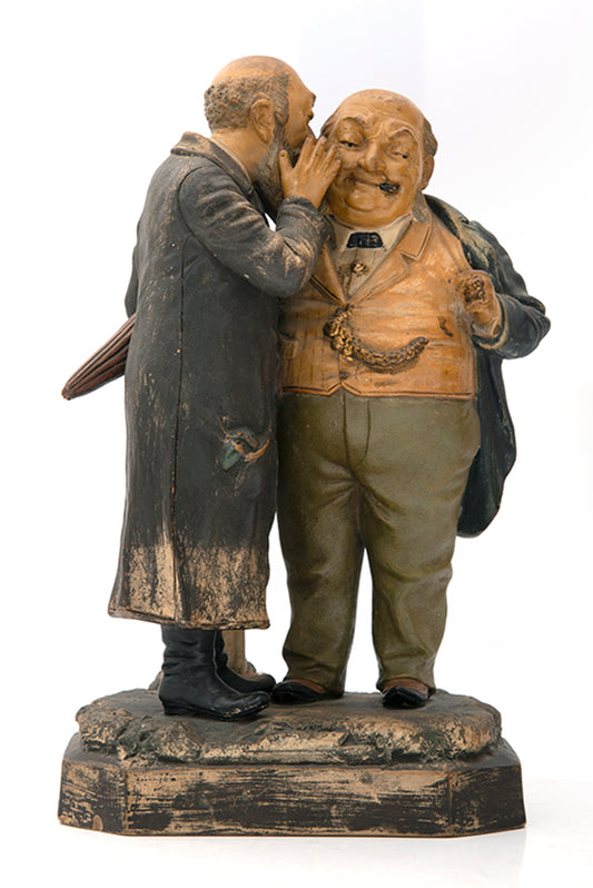 A rare hand-painted ceramic sculpture by Maresch, depicting a Jewish man in traditional long black frock whispering into the ear of a wealthy financier.